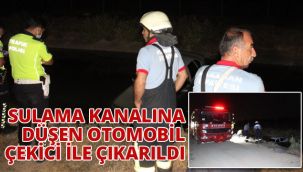 Sulama kanalına düşen otomobil çekici ile çıkarıldı