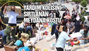 Yardım kolisini sırtlanan meydana koştu 