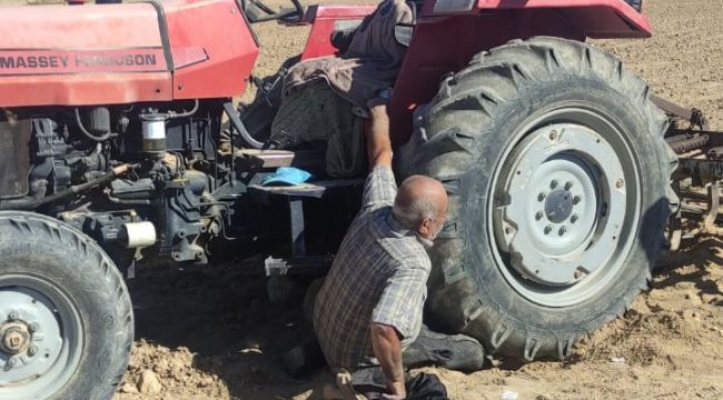 Traktörün altında kalan sürücüyü itfaiye kurtardı